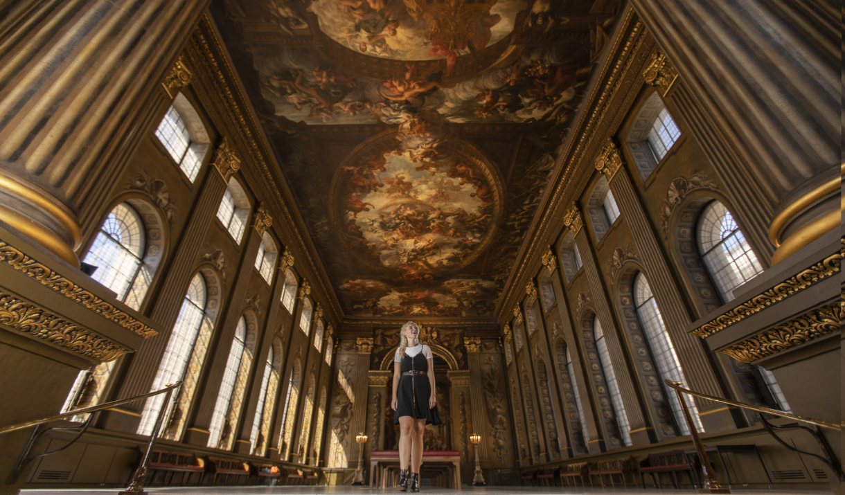 A girl stands in the Painted Hall at the Old Royal Naval College